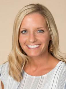 Headshot of Lindsey Angst. She has blond hair and is wearing a white blouse.